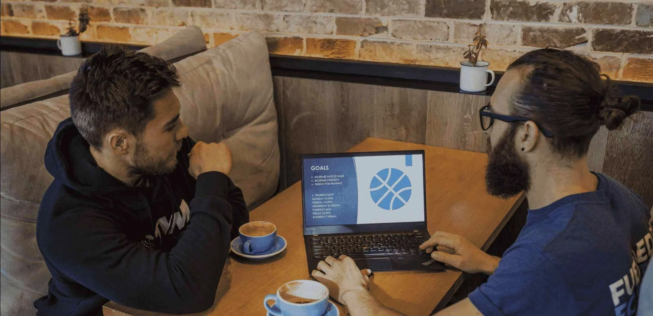 Josh coaching a client over coffee